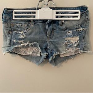 American Eagle jean shorts with lace pockets